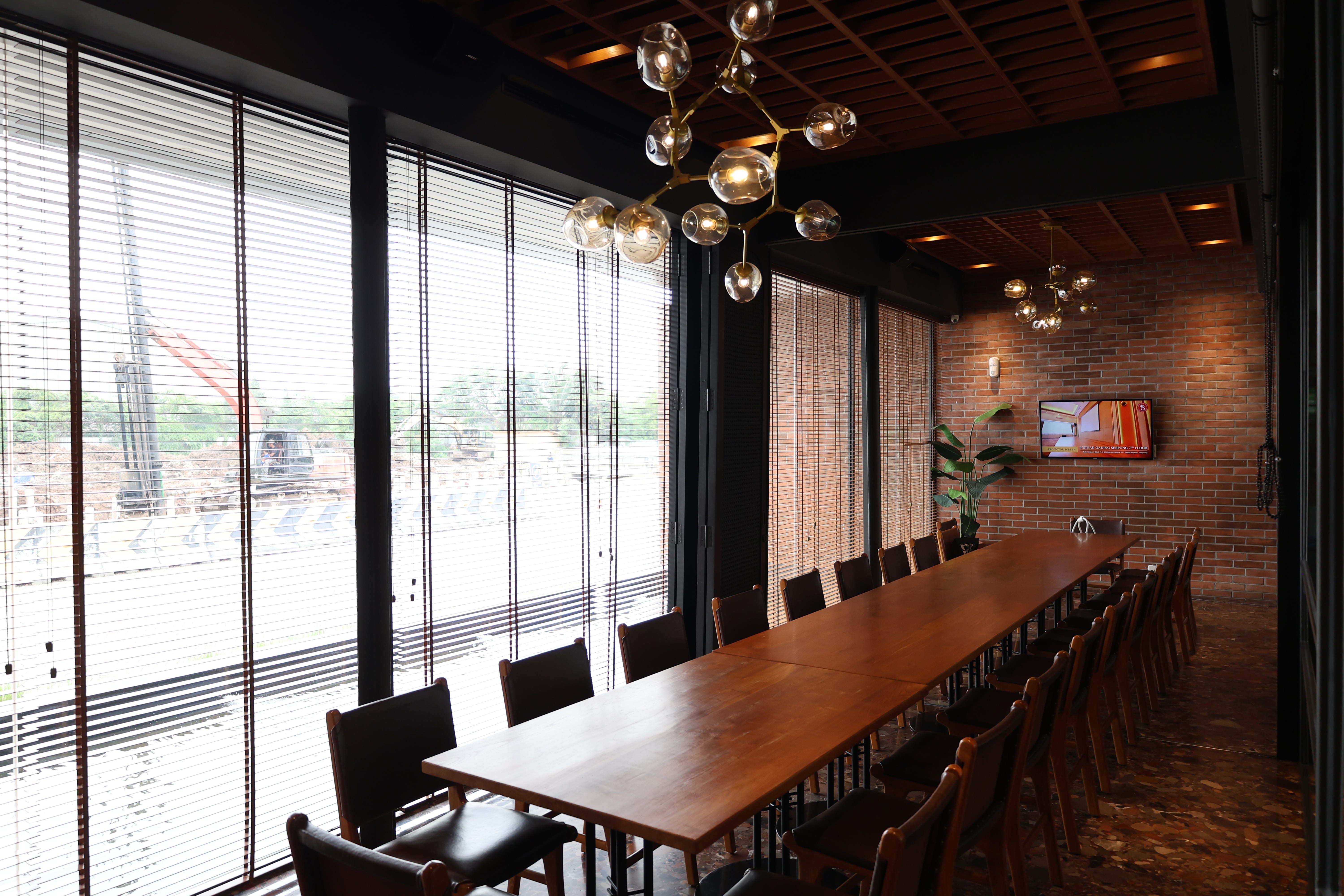 VIP private dining room at BSteak with long solid wood table and coffered wood ceiling by Reywood